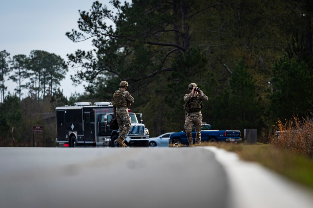 A photo of two Airmen at the scene of a UXO