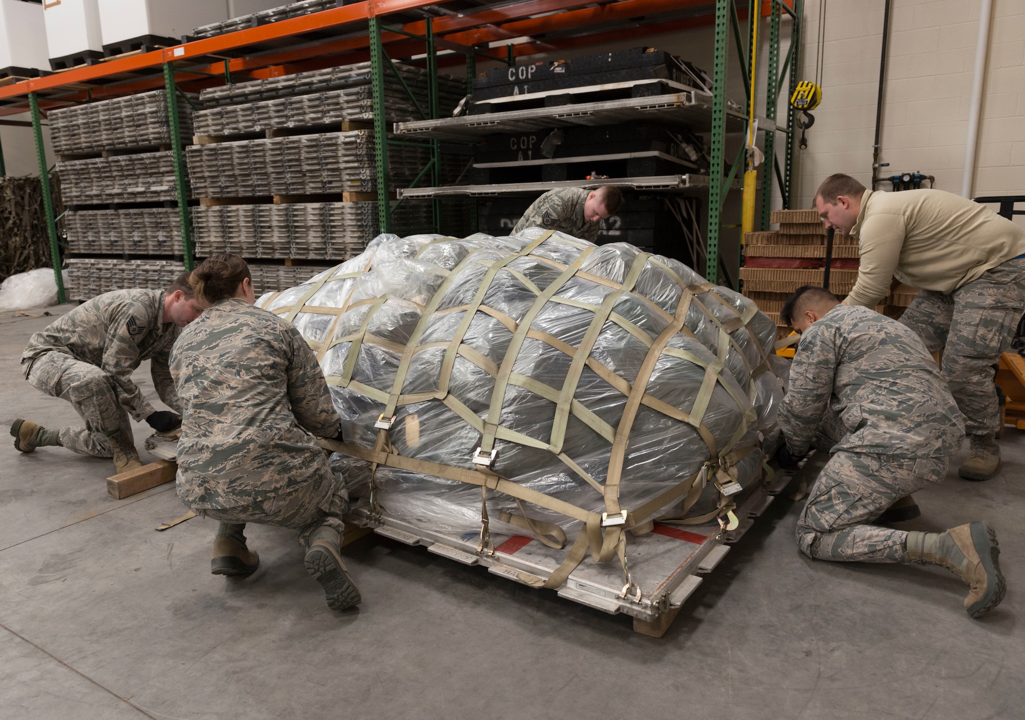 U.S. Air Force Airmen, assigned to the Logistics Readiness Squadron at the 103rd Airlift Wing, Connecticut Air National Guard, secure a pallet at Bradley Air National Guard Base, East Granby, Conn., Jan. 5, 2020. The 103rd AW conducted a base-wide deployment exercise to enhance Airmen’s readiness for rapid mobility. (U.S. Air National Guard photo by Airman 1st Class Chanhda Ly)