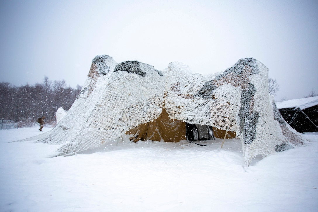 A military shelter in the snow.