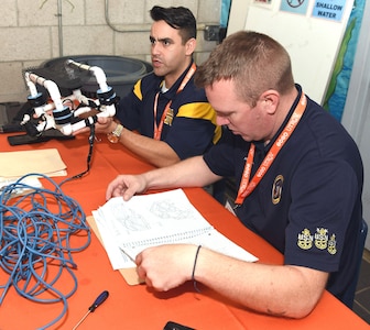 Chief Petty Officer Joseph Corbeil (left), leading chief petty officer assigned to Navy Recruiting Station Harlingen and Chief Petty Officer Alexander Glenn, a division leading chief petty officer assigned to Navy Recruiting District San Antonio, served as interview judges during the HESTEC 2020 SeaPerch Challenge held at the Margaret M. Clark Aquatic Center in Brownsville, Texas. The annual underwater robotics competition, hosted by the University of Texas Rio Grande Valley, in partnership with NRD San Antonio, kicked-off a new format to Hispanic Engineering, Science and Technology, or HESTEC, this year.