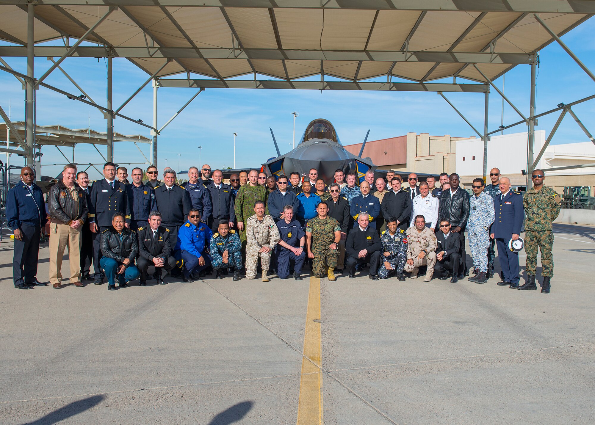Students and staff from the Naval Command College pose with an F-35A Lightning II, Jan. 14, 2020, at Luke Air Force Base, Ariz.