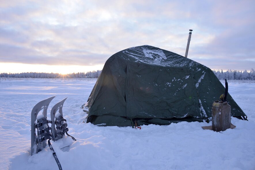 A cold-weather tent sits in subzero temperatures in the Husky Drop Zone at Eielson Air Force Base, Alaska, Jan. 15, 2020. Tactical air control party Airmen from Detachment 1, 3rd Air Support Operations Squadron, set up temporary lodging during a three-day field training event held from Jan. 14-16. (U.S. Air Force photo by Capt. Kay Magdalena Nissen)