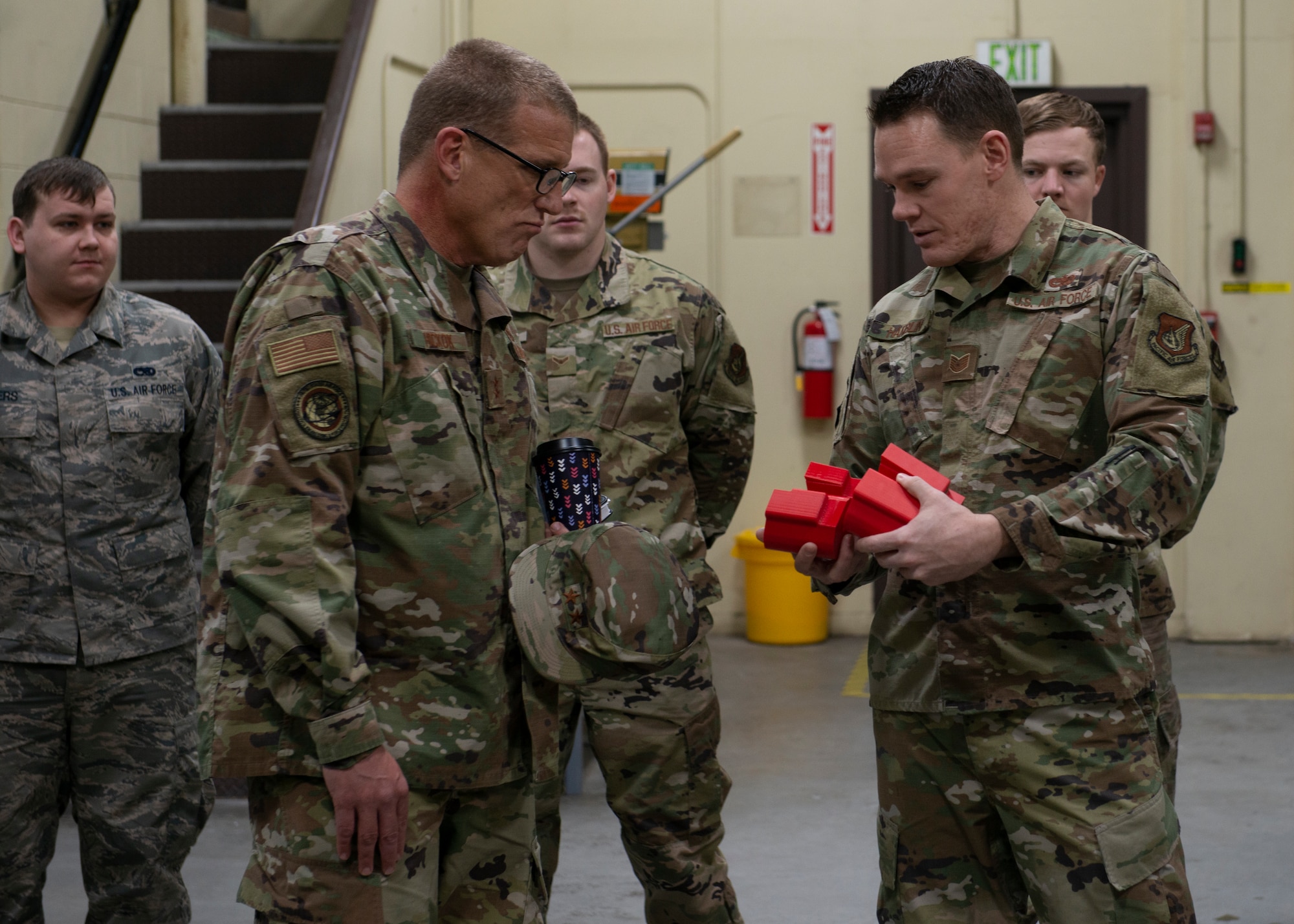 U.S. Air Force Tech. Sgt. Jeremy Hamblin, 3rd Maintenance Squadron metals technology journeyman, talks to U.S. Air Force Maj. Gen. John Hickok, Installation Excellence Selection Board member, about 3D printed projects during the 2020 Commander in Chief’s Installation Excellence Award site inspection at Joint Base Elmendorf-Richardson, Alaska, Jan. 13, 2020. JBER is competing as a finalist for the CINC IEA. This presidential award recognizes innovation and superior operation of military installations that have best used their resources to support the mission.