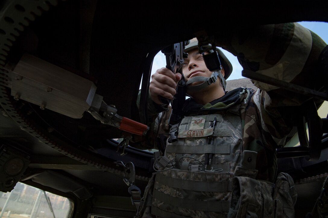 A 51st Security Forces Squadron defender scans the perimeter as part of a Combat Readiness Course, Dec. 16, 2019, at Osan Air Base, Republic of Korea. The course challenges Osan’s newest defenders on their readiness and skills to defend the base. (U.S. Air Force photo by Staff Sgt. Greg Nash)