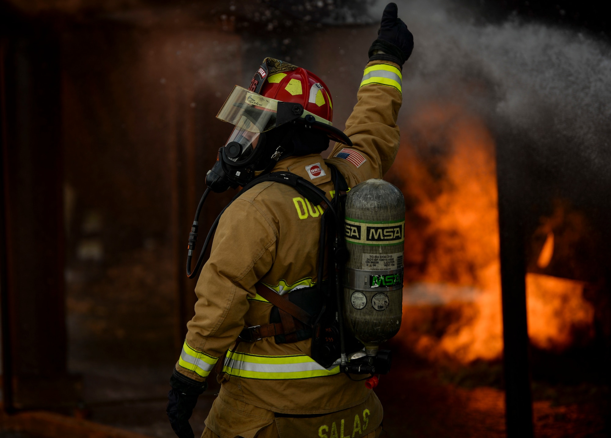 Tech. Sgt. Jordan Salas, a fire training NCO in charge, assigned to the 36th Civil Engineer Squadron, Andersen Air Force Base, Guam conducts a live fire training burn, January 8, 2020, at AAFB.