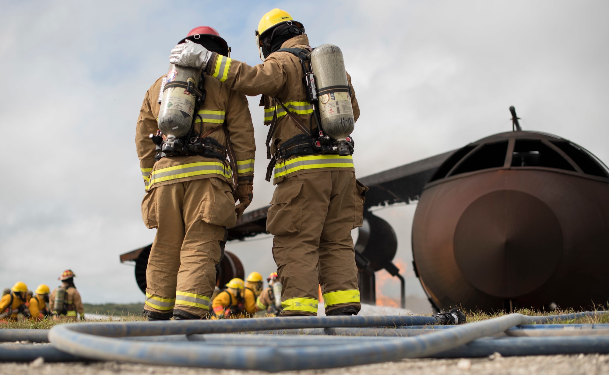 Firefighters from the Pacific Region participate in a live fire training burn, January 8, 2020, at Andersen Air Force Base, Guam.