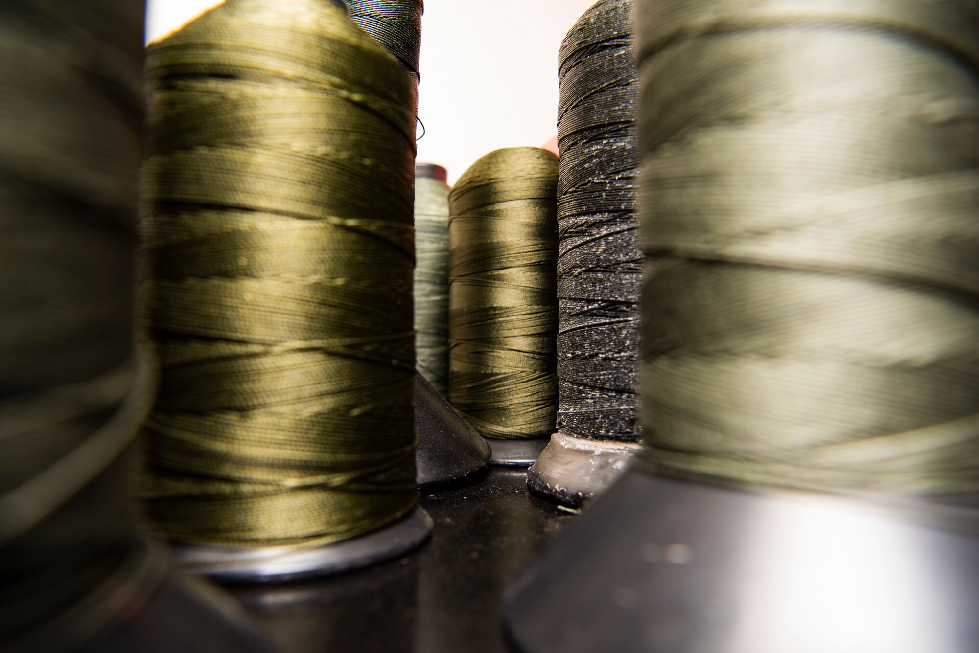 Spools of string is shown in an 69th Expeditionary Bomb Squadron aircrew flight equipment shop at Andersen Air Force Base, Guam, Jan. 16, 2020.