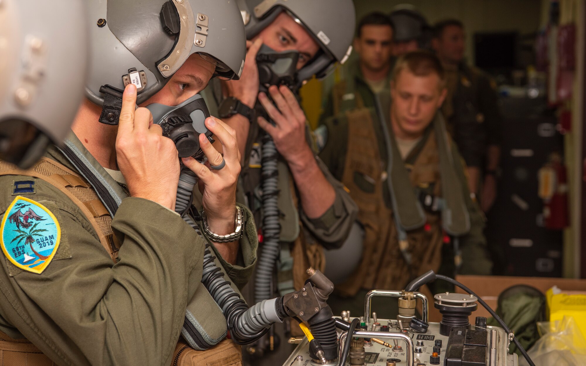 69th Expeditionary Bomb Squadron pilots, check equipment functionality before a flight at Andersen Air Force Base, Guam, Jan. 16, 2020.
