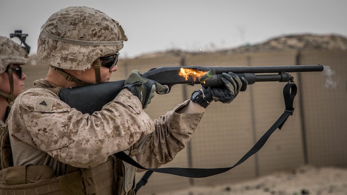 A U.S. Marine fires a Mossberg 590A1 12-gauge shotgun during a non-lethal weapons training exercise, Jan. 18.