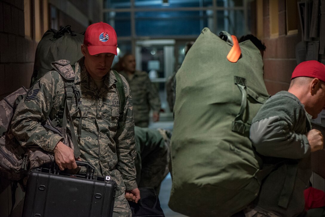 U.S. Air Force Airmen, assigned to the 200th RED HORSE Squadron, Ohio Air National Guard, depart for Puerto Rico following activation in response to earthquake disaster relief efforts, Jan. 17, 2020. Along with personnel, the Ohio National Guard unit contributed two Disaster Response Bed-down Systems, each with the ability to provide power and potable water systems for billeting, health and hygiene support for up to 150 people. (U.S. Air National Guard photo by Tech. Sgt. Joe Harwood)