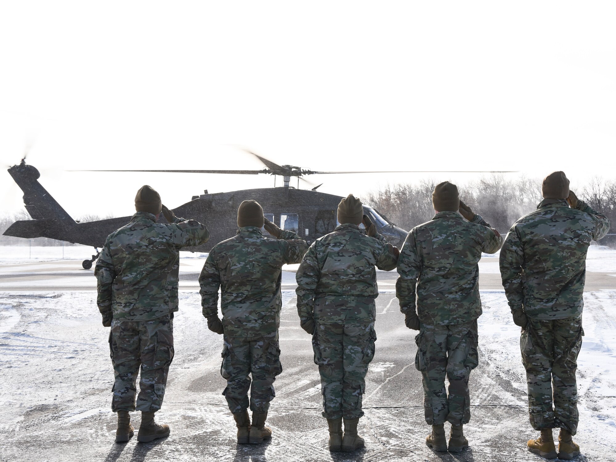 Base leaders greet General John Raymond, U.S. Space Force chief of space operations, on their helicopter pad Jan. 10, 2020, on Cavalier Air Force Station, North Dakota. Raymond arrived to Cavalier after visiting the University of North Dakota, where he toured the new Walking Space Studies facility and spoke with Reserve Officer Training Corps and Space Studies students. (U.S. Air Force photo by Senior Airman Melody Howley)