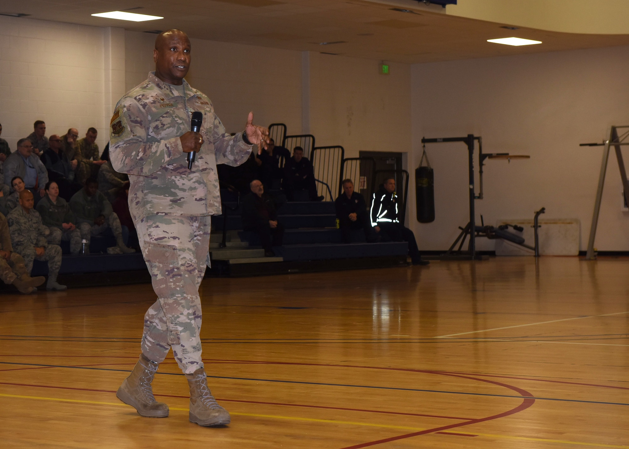 Col. Devin Pepper, 460th Space Wing commander, speaks to military members and civilian personnel in the fitness center at Buckley Air Force Base, Colo., Jan. 16, 2020. Pepper held a commander’s call to address changes the creation of the Space Force will bring to Buckley AFB and its members. (U.S. Air Force photo by Airman 1st Class Haley N. Blevins)