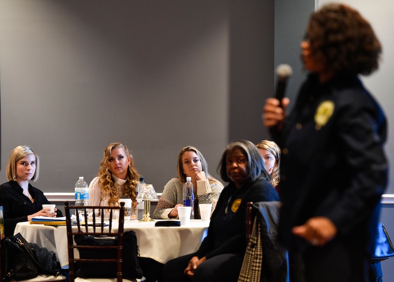 Members from Joint Base McGuire-Dix-Lakehurst, New Jersey and the National Organization of Black Women in Law Enforcement listen on as Michelle Bracken gives a presentation during the Women Defenders Symposium Jan. 17 in Philadelphia, Pennsylvania. A few topics that were discussed amongst the group comprised of gaining courage, recognizing your strengths and building resilience.