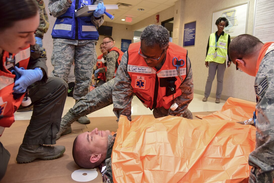 Capt. Judd Hailey, 47th Medical Group base operational medicine clinic flight commander, assesses simulated injuries of a volunteer patient during the Ready Eagle exercise on Jan. 17, 2020, at Laughlin Air Force Base, Texas. Lt. Col. Brian Caruthers, Air Education and Training Command medical readiness division chief, visited the base throughout the week and observed the exercise. “This experience is designed to leave team chiefs and the wing inspection team members a set of standardized training tools and techniques to create their own home station training program,” Caruthers said. (U.S. Air Force photo by Senior Airman Anne McCready)
