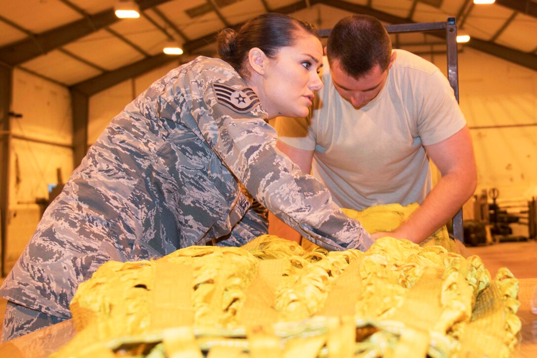 Photo of Johnson packing a B-52 drag chute.