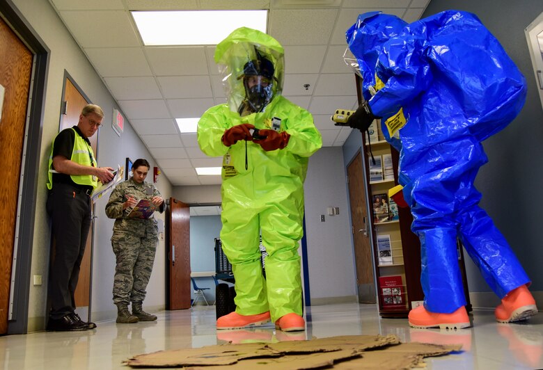 Capt. Eduardo Artiga, 47th Operational Medical Readiness Squadron bioenvironmental flight commander, and Airman 1st Class Alfredo Gomez, 47th OMRS bioenvironmental technician, survey the simulated explosion site during the Ready Eagle exercise on Jan. 17, 2020, at Laughlin Air Force Base, Texas. The two scanned the area for radiation, took photos to record the scene before and after clean-up and retrieved samples for testing. (U.S. Air Force photo by Senior Airman Anne McCready)