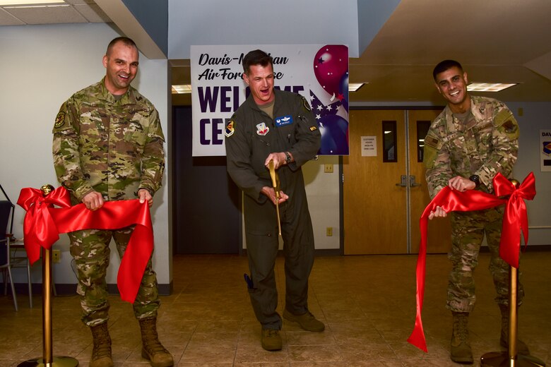 photo of the Wing commander cutting ribbon to open welcome center