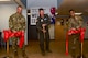 photo of the Wing commander cutting ribbon to open welcome center