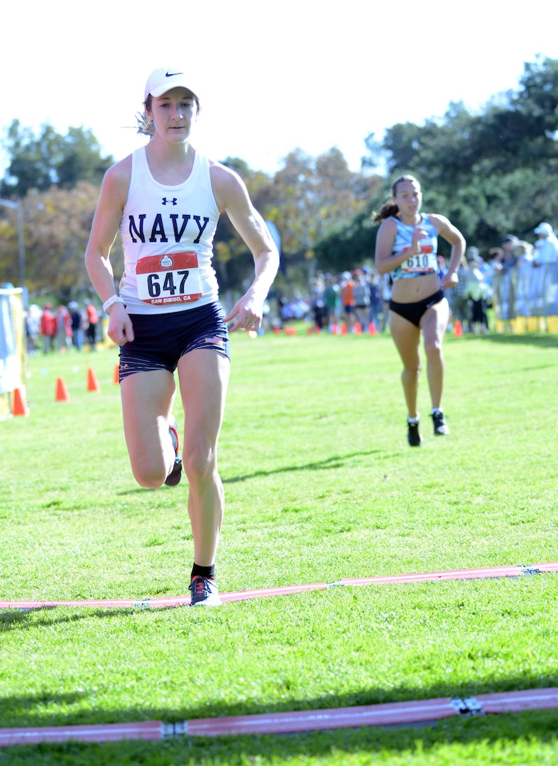 Navy Lt. j.g. Rachel Viger of the Naval Operations Support Center Washington, D.C., crosses the finish line at 39:49 to finish third in the Armed Forces Cross Country Championship at Mission Bay Park in San Diego, Jan. 18, 2020.