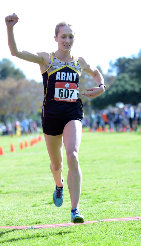 Army Maj. Kelly Calway, of Joint Base Myer-Henderson Hall, crosses the finish line of  the Armed Forces Cross Country Championship at Mission Bay Park in San Diego, Jan. 18, 2019, to finish fifth with a time of 40:31.