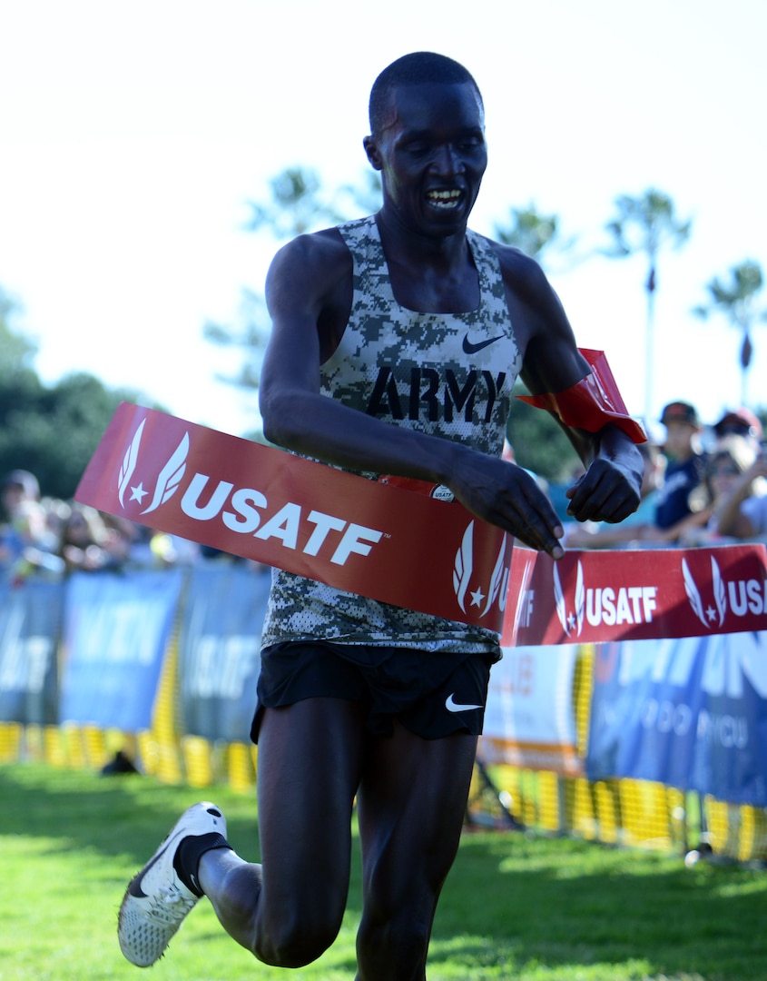 Cpl. Anthony Rotich of Fort Carson, Colo., crosses the finish line with a time of 30:36 to win both the Armed Forces Cross Country Championship and the USA Track and Field senior men 10K race at Mission Bay Park in San Diego, Calif, Jan. 18, 2020.