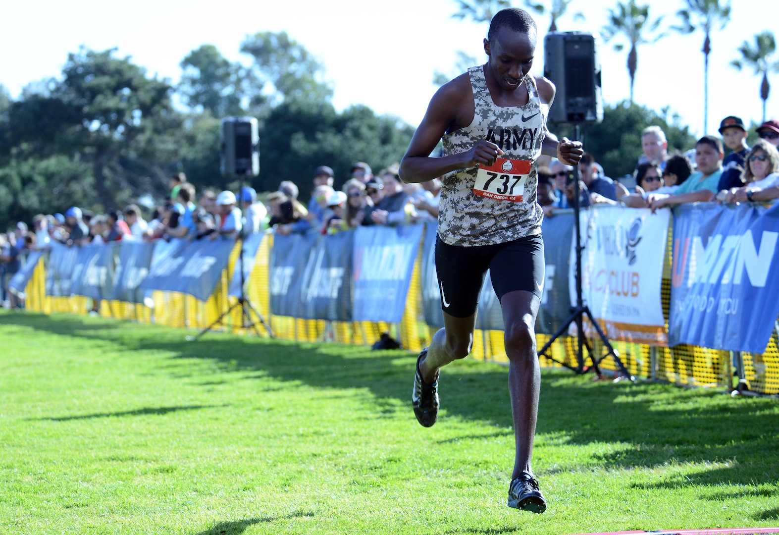 Army Spc. Lawi LaLang crosses the finish line of the Armed Forces Cross Country Championship at Mission Bay Park in San Diego, Jan. 18, 2020, with a time of 31:00 to take third place. The race was run concurrently with the USA Track and Field senior men 10K and LaLang took bronze in both.