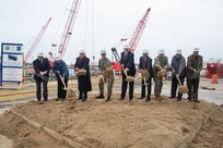 Participants in Norfolk Naval Shipyard’s Dry Dock 4 renovation groundbreaking Jan. 23 include, from left to right: Drew Quiroz, President, Asturian-Consigli JV; Stephanie Douglas, NAVSEA Director of Industrial Operations (SEA 04); John Rowe, Mayor, City of Portsmouth; Capt. Kai Torkelson, Commander, Norfolk Naval Shipyard; James Geurts, Assistant Secretary of the Navy (Research, Development and Acquisition); Congressman Robert “Bobby” Scott, 3rd District of Virginia; Cmdr. William Butler, NAVFAC Public Works Officer, Norfolk Naval Shipyard; Robert Fogel, Project Superintendent, Industrial Facilities and Equipment, Norfolk Naval Shipyard; and Stan Magann, Vice President, W.F. Magann Corporation.