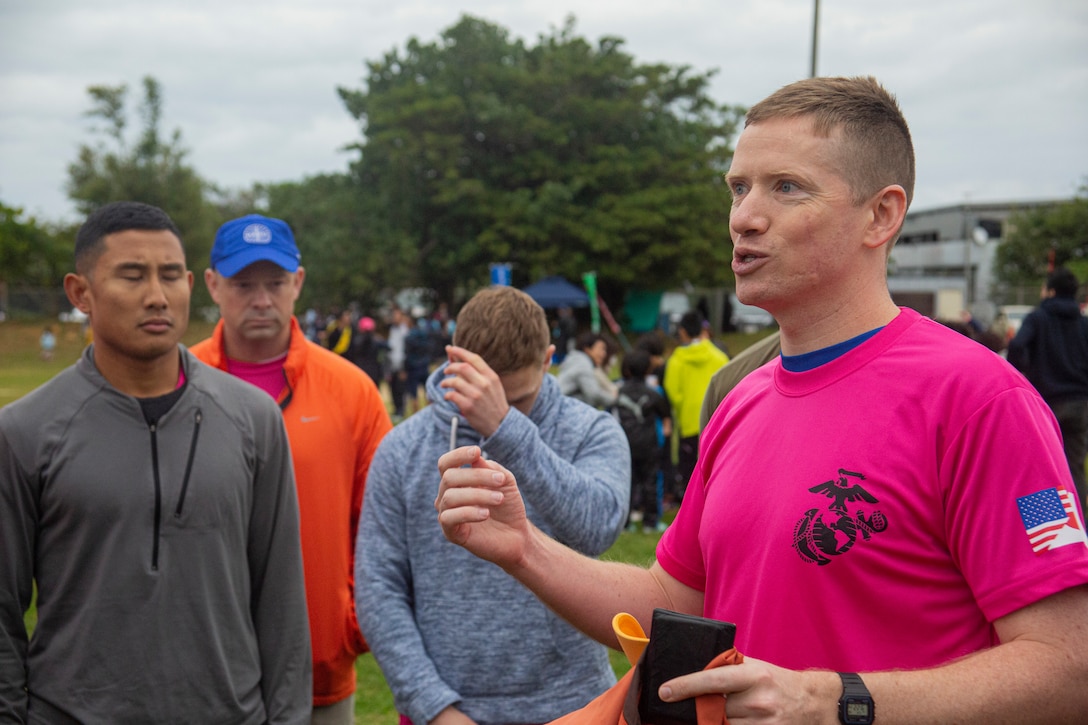 U.S. Navy Lt. j. g. Brian Bort, a chaplain assigned to Marine Corps Air Station (MCAS) Futenma, gives remarks before the 43rd Annual Ginowan Safety Relay starts at MCAS Futenma, Okinawa, Japan, Jan. 18, 2020. The relay race was held to raise awareness for road safety and to build the relationship between the U.S. military and local Okinawa communities. (U.S. Marine Corps photo by Lance Cpl. Zachary R. Larsen)