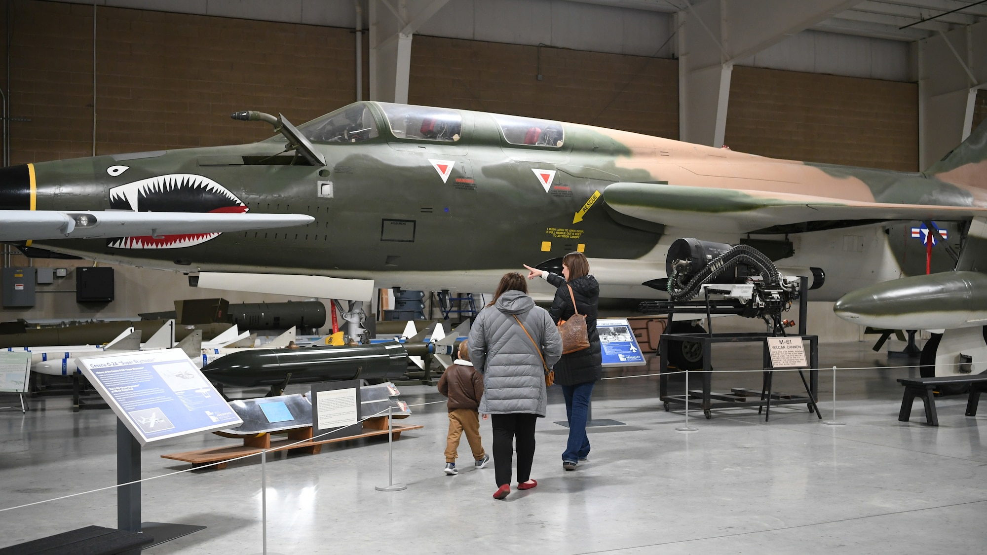 Visitors stop by the Hill Aerospace Museum’s Cessna O-2A static Dec. 20, 2019, at Hill Air Force Base, Utah. The museum recently celebrated its 5 millionth visitor in November 2019.  (U.S. Air Force photo by Cynthia Griggs)