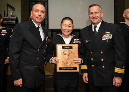 YOKOSUKA, Japan (January 23, 2020) Operations Specialist 1st Class Diana Park, from Winter Springs, Florida, assigned to Expeditionary Strike Group (ESG) 7, receives the U.S. 7th Fleet Sea Sailor of the Year Award from Rear Adm. Ted LeClair, deputy commander, U.S. 7th Fleet and Command Master Chief Jason Haka. The 7th Fleet Sailor of the Year Week is designed to share with these outstanding Sailors the unique operational environment in the 7th Fleet as well as enhance regional partnerships with like-minded forces.