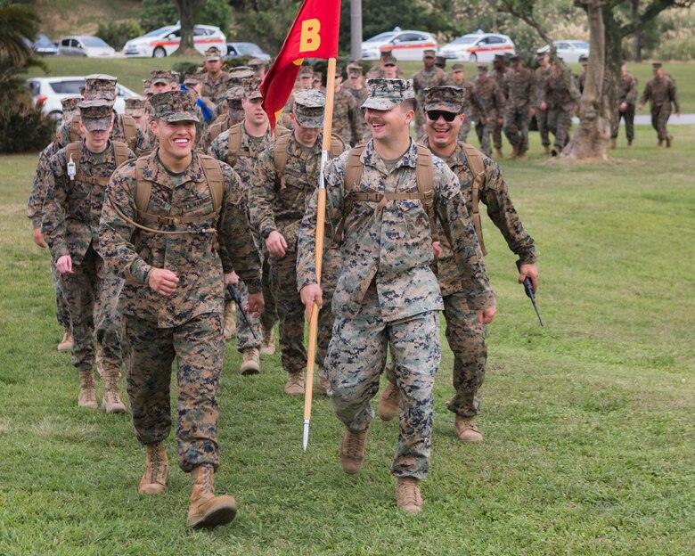 U.S. Marines and sailors assigned to Headquarters and Support Battalion, Marine Corps Installations Pacific, participate in a hike in honor of Martin Luther King Jr. around Camp Foster, Okinawa, Japan on Jan. 16, 2019.