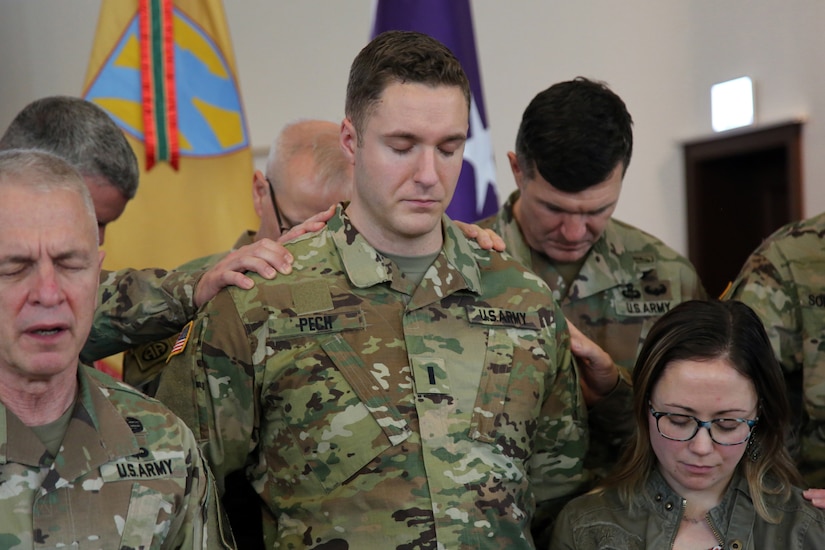 U.S. Army Chief of Chaplains, Chaplain (Maj. Gen.) Thomas L. Solhjem, leads a prayer for newly appointed U.S. Army Reserve Chaplain (1st Lt.) Gabriel Pech, 7th Mission Support Command, before he receives the Army Chaplain cross during a pinning ceremony held at the Daenner Kaserne Chapel in Kaiserslautern, Germany on January 22, 2020. Pech was the first U.S. Army Reserve officer to complete the Chaplain Candidate Program in Europe.