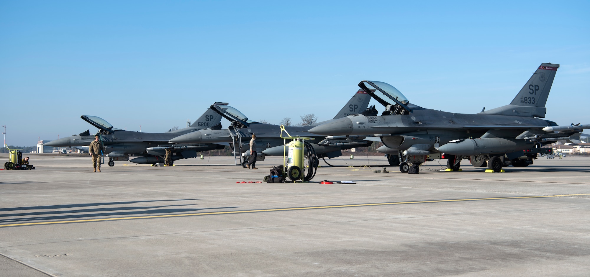U.S. Airmen from the 52nd Fighter Wing finish fueling and arming F-16 Fighting Falcons on the flightline at Ramstein Air Base, Germany, Jan. 22, 2020. The effort was in support of an Agile Combat Employment Exercise. The goal of ACE is to generate airpower in any environment with minimal personnel and equipment, and deter threats. (U.S. Air Force photo by Airman 1st Class Valerie Seelye)