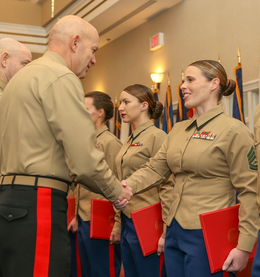 U.S. Marine Corps Gen. David H. Burger, Commandant of the Marine Corps, presents the Active Reserves Career Plannerof the Year award to Gunnery Sgt. Kristina M. Perieff, career planner, Marine Aircraft Group 41, 4th Marine Aircraft Wing New Orleans, La., at the Commandant of the Marine Corps’ Combined Awards Ceremony at The Clubs at Quantico aboard Marine Corps Base Quantico, Va., Jan. 22, 2020. The ceremony recognizes commands with the highest combined physical and combat fitness performance, as well as top recruiters, instructors, athletes, and career planners around the Marine Corps. (U.S. Marine Corps photos by Lance Cpl. Piper A. Ballantine)