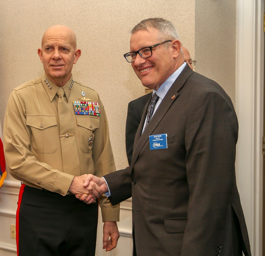 U.S. Marine Corps Gen. David H. Burger, Commandant of the Marine Corps, shake hands with John Davis, director of Legislate Programs at the Commandant of the Marine Corps’ Combined Awards Ceremony at The Clubs at Quantico aboard Marine Corps Base Quantico, Va., Jan. 22, 2020. The ceremony recognizes commands with the highest combined physical and combat fitness performance, as well as top recruiters, instructors, athletes, and career planners around the Marine Corps. (U.S. Marine Corps photos by Lance Cpl. Piper A. Ballantine)