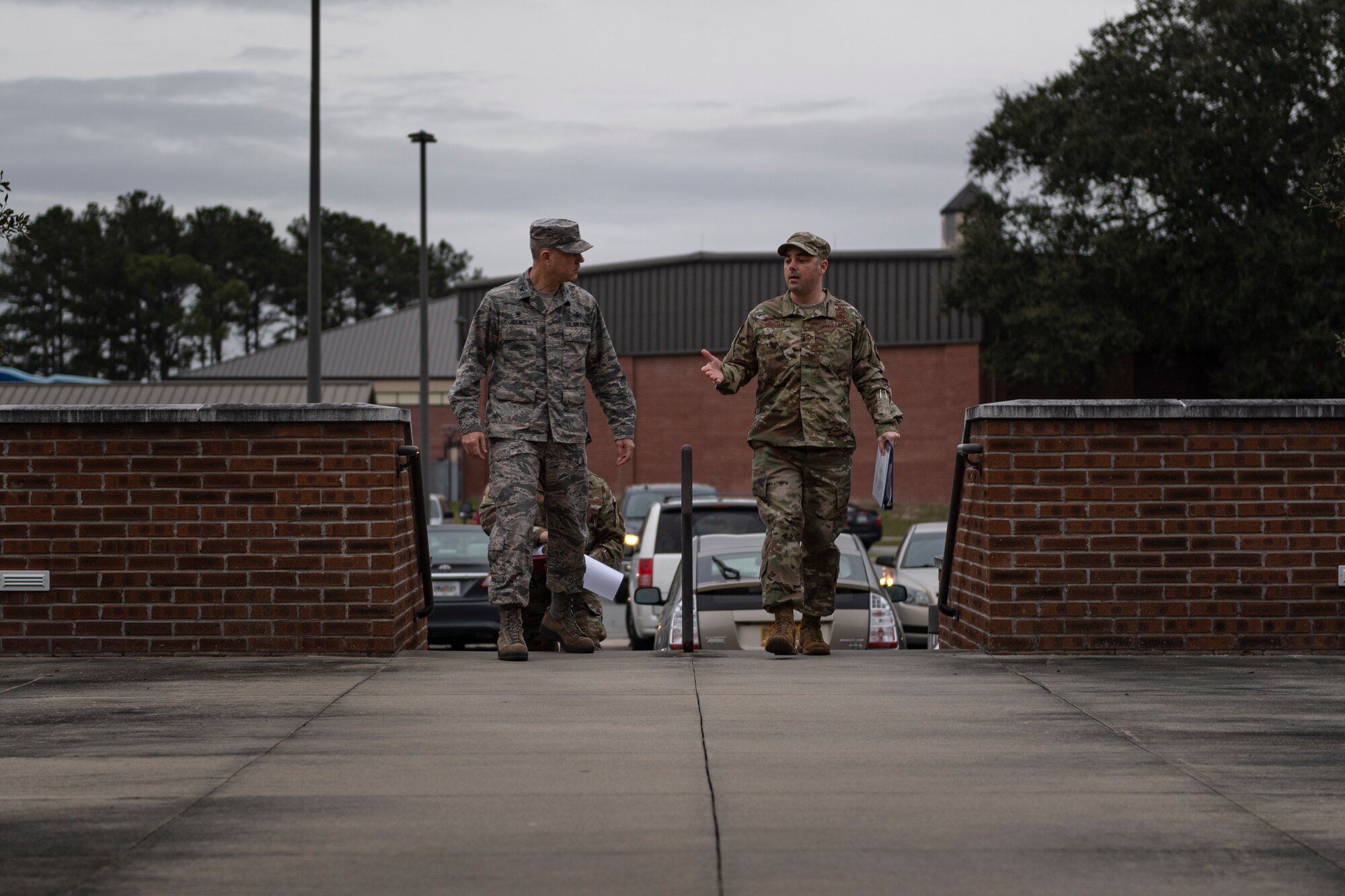 A photo of Airmen walking to a building