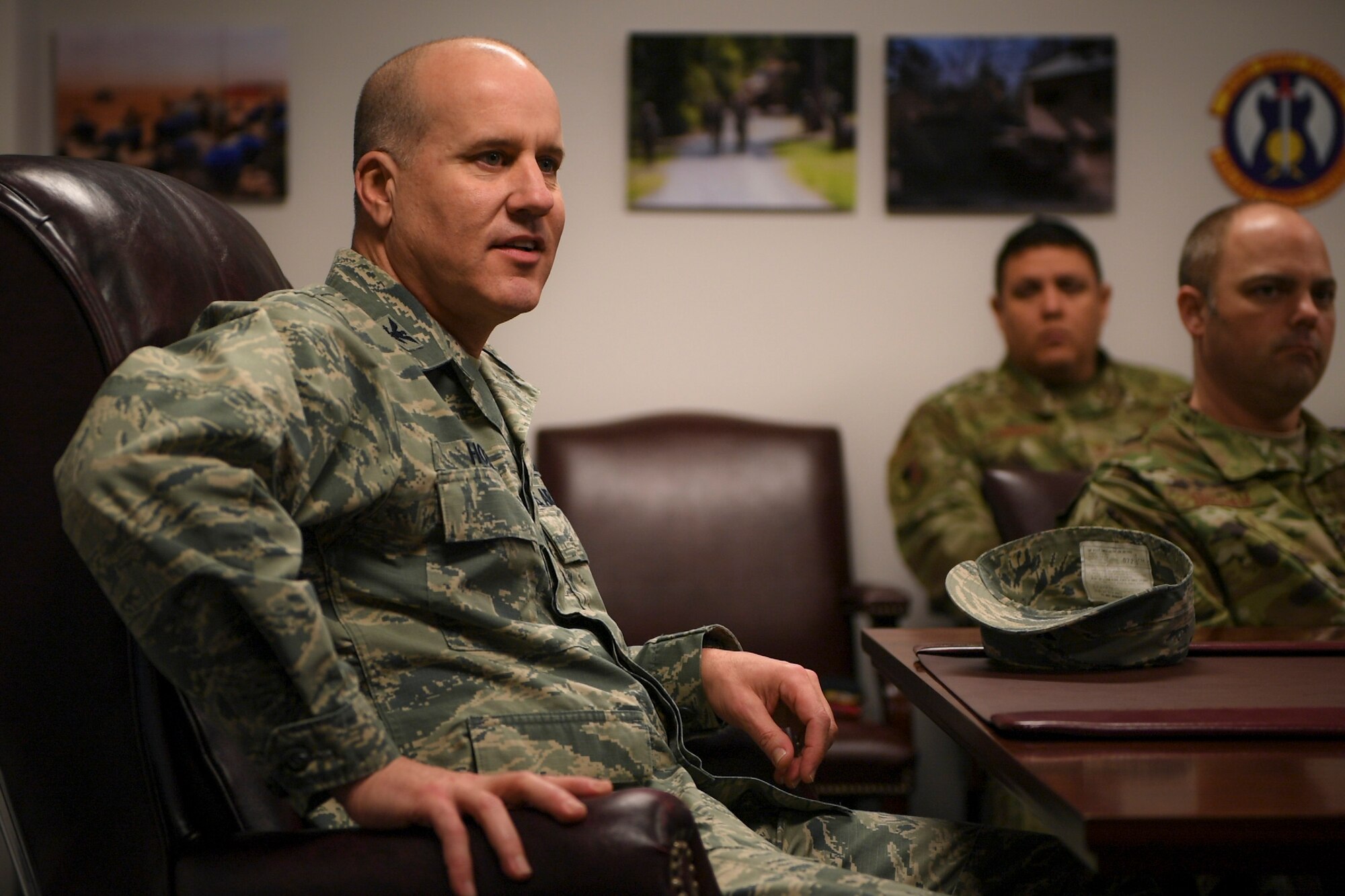A photo of an Airman talking