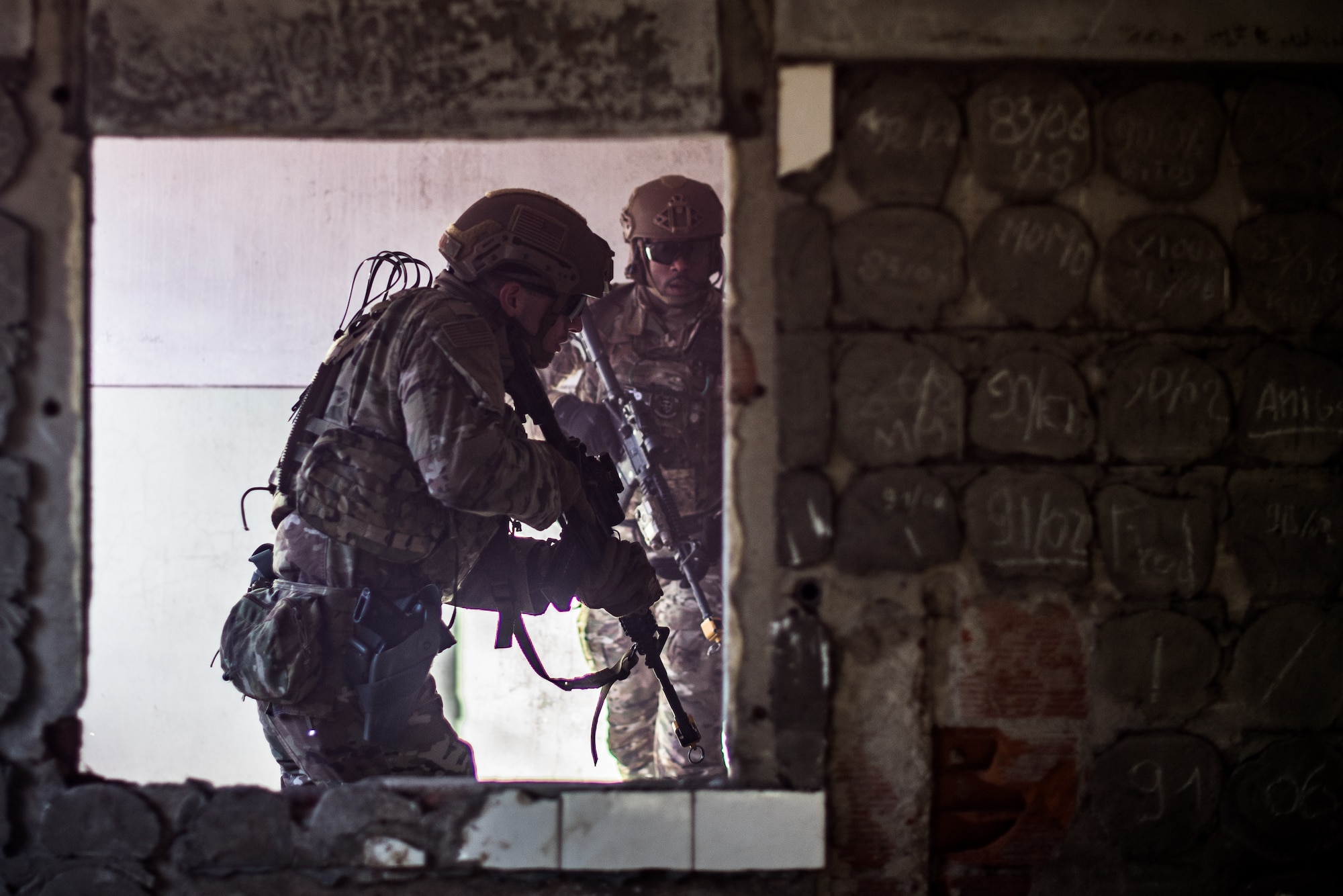 U.S. Airmen assigned to the 435th Security Forces Squadron clear out a building during exercise Frozen Defender in Grostenquin, France, Jan. 16, 2020. The Defenders faced opposition forces to test their ability to secure an airfield in a contested environment. (U.S. Air Force photo by Staff Sgt. Devin Boyer)