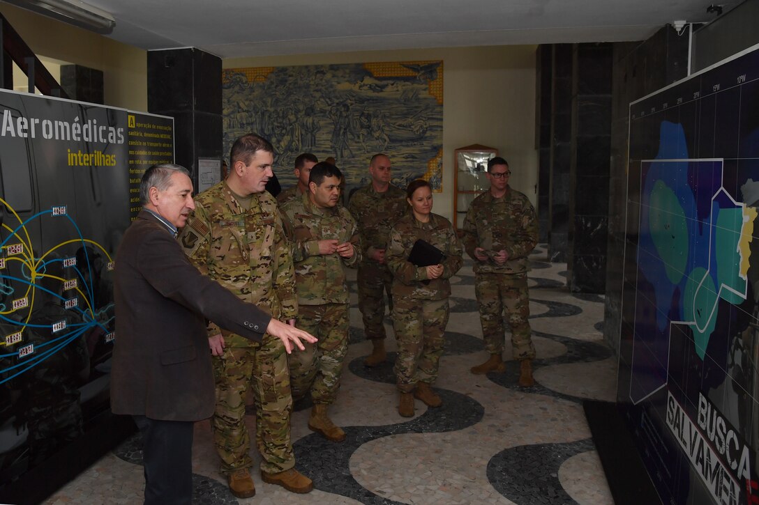 U.S. Air Force Brig. Gen. Mark R. August, 86th Airlift Wing commander, second from left, and U.S. Air Force Chief Master Sgt. Ernesto J. Rendon, 86th AW command chief, third from left, meet with retired Portuguese Air Force Brig. Gen. Eduardo Faria and 65th Air Base Group leadership to tour the aviation museum at Lajes Field, Portugal, Jan. 21, 2020.