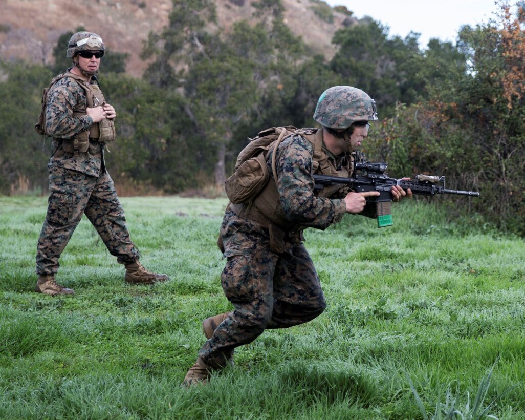 A U.S. Marine with Charlie Company, Infantry Training Battalion, School of Infantry - West, buddy rushes during the last live-fire range of the Rifleman Course at Range 208C on Marine Corps Base Camp Pendleton, California, Jan. 22, 2020. ITB trains, develops and certifies Marines as riflemen, as well as their primary military occupational specialty within the infantry field, before sending them to join the Fleet Marine Force. (U.S. Marine Corps Photo by Lance Cpl. Angela E. Wilcox)