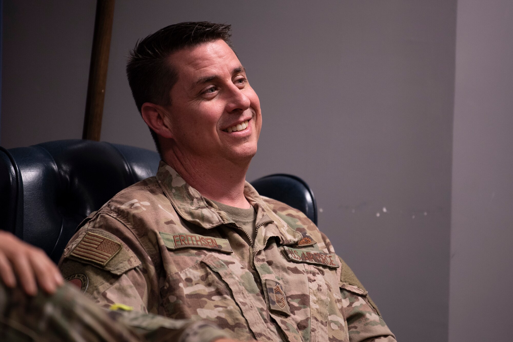 A photo of an Airman smiling during the Airman Leadership School Class 20-B’s Chief Panel.