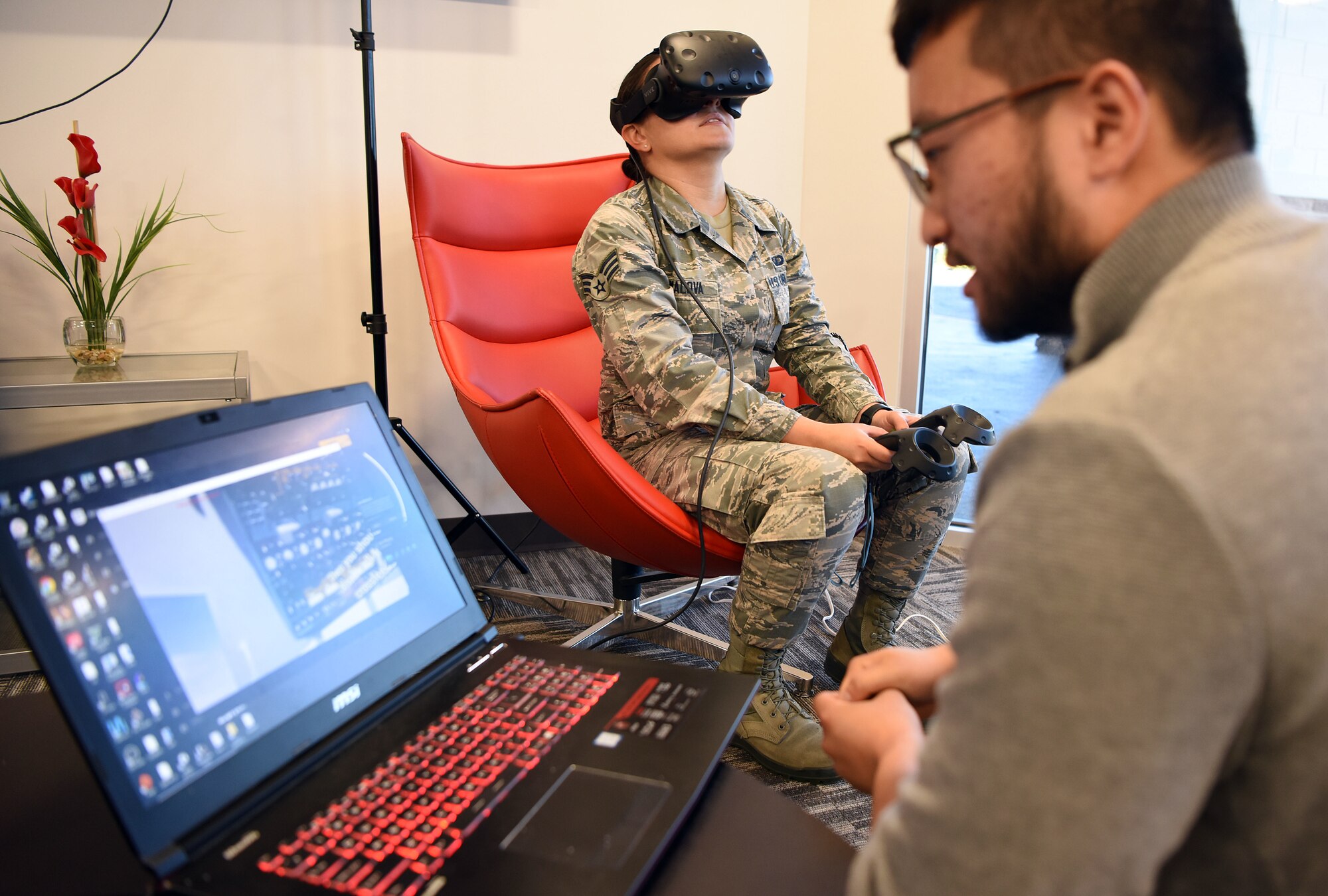 Senior Airman Alzara Kimalova, Air Force Sustainment Center contract specialist, walks through power-off procedures for C-130H Hercules through virtual reality technology at the Inaugural Pitch Day hosted by the Robins Spark Cell and AFSC Contracting located at Robins Air Force Base, Ga., Sept. 20, 2019, at the Advanced Technology and Training Center in Warner Robins, Ga. The event is an initial prototype effort to assess the capabilities of current commercially available virtual reality training systems when used in a military environment, particularly within the 461st and 116th Air Control Wings at Robins. (U.S. Air Force photo by Tommie Horton)