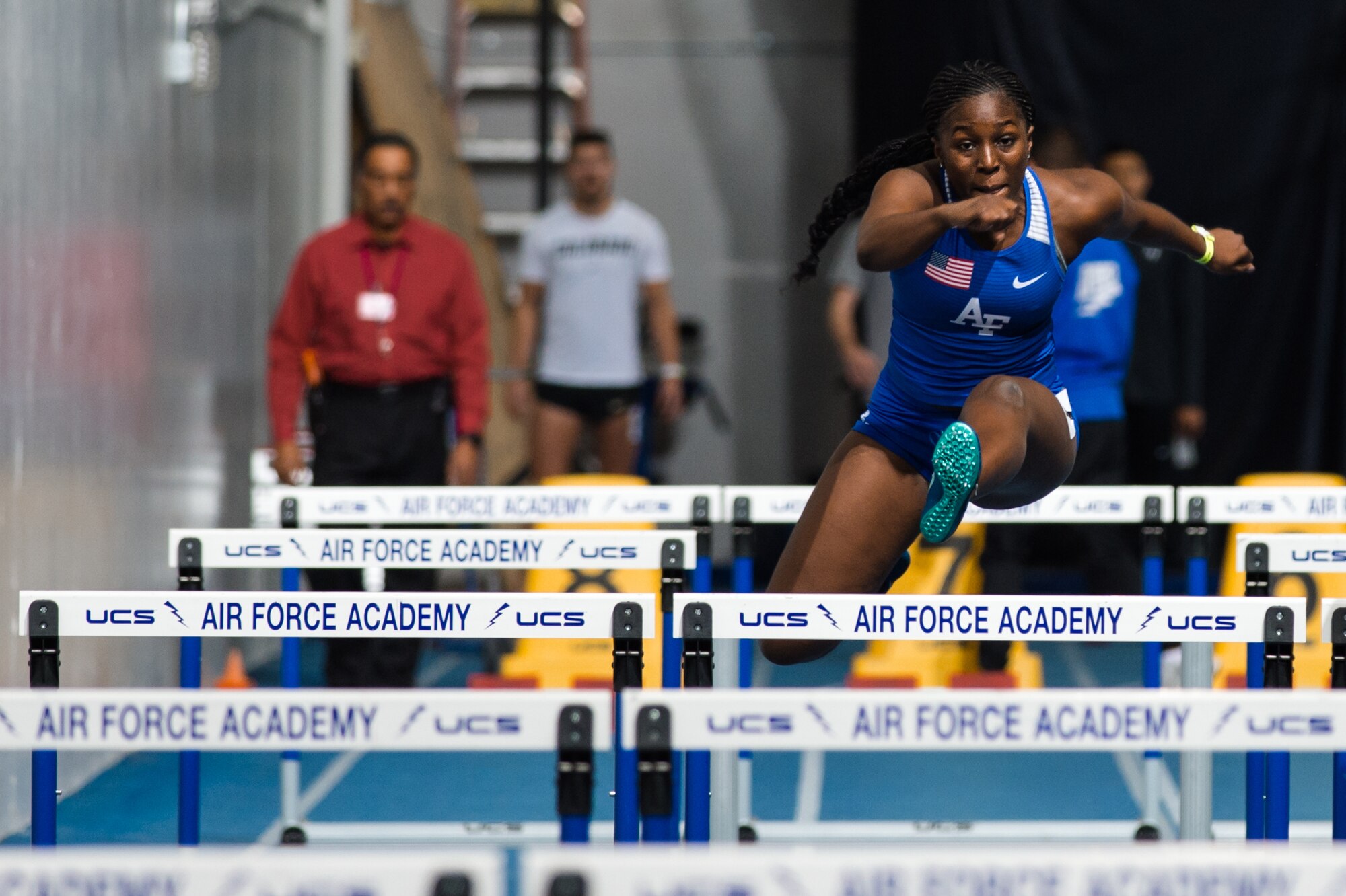 U.S. Air Force Academy cadet, leaps over a hurdle during her 60m hurdle race