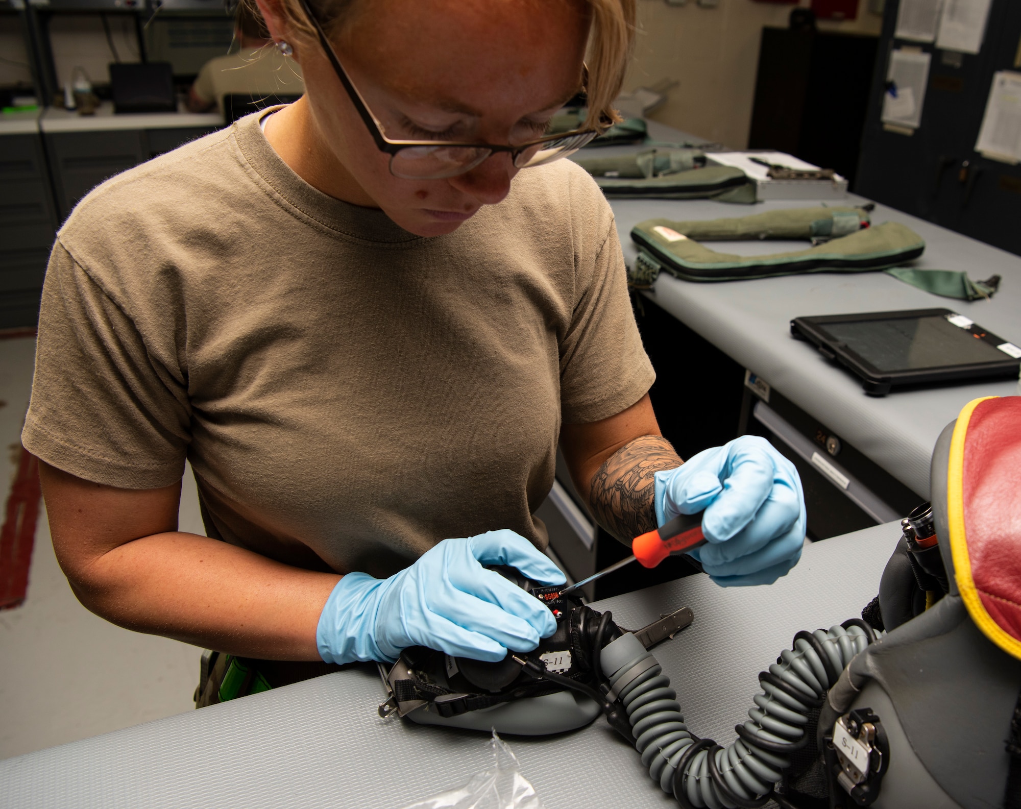 Senior Airman repairs a mask