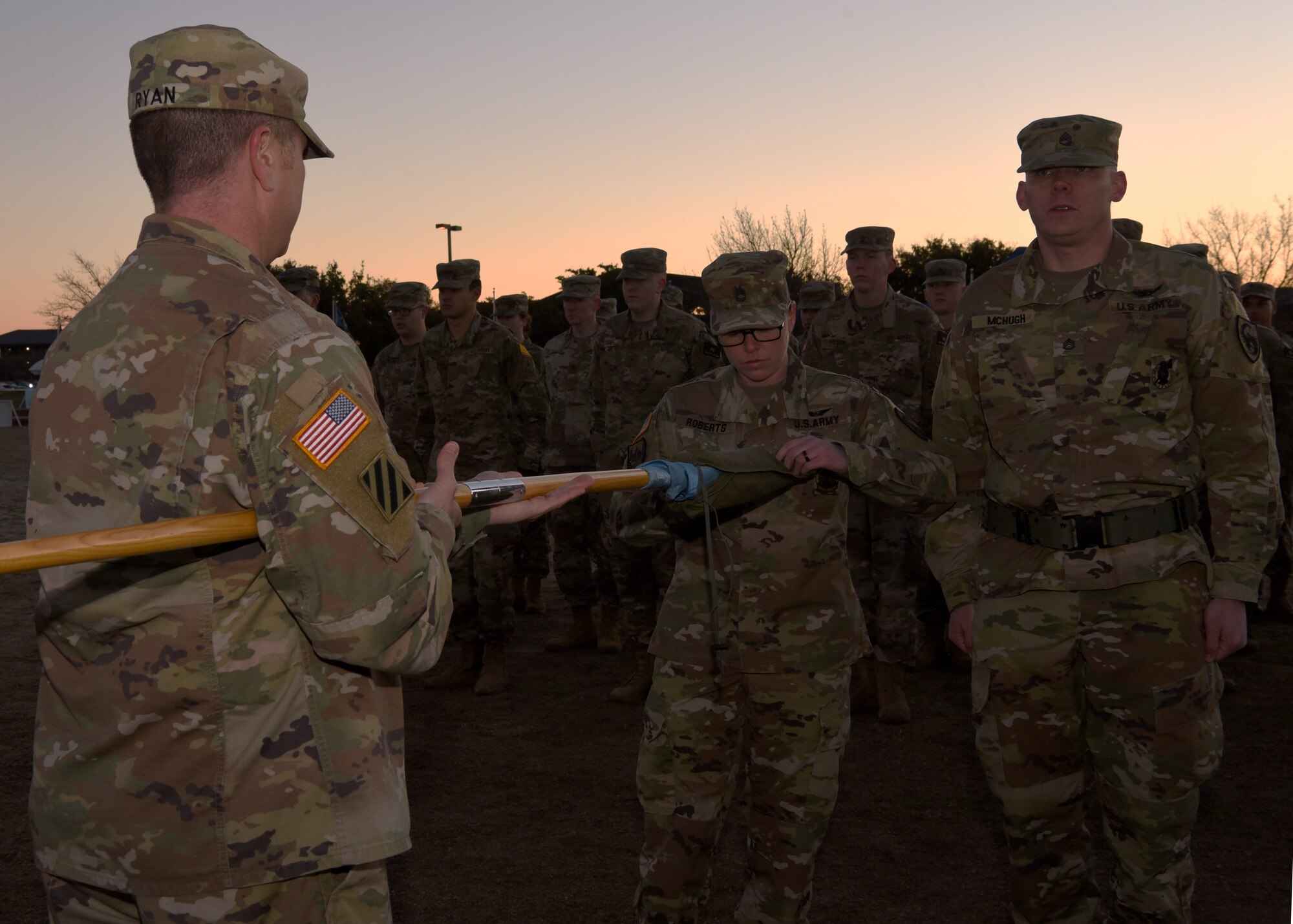 U.S. Army First Sgt. Hilary Roberts, 344th Military Intelligence Battalion basic analysis and reporting course senior instructor, uncases the Charlie Company Guidon at the Activation Ceremony and Assumption of Command on the parade field at Goodfellow Air Force Base, Texas, Jan. 24, 2019.  Uncasing the Guidon marked Charlie Company’s history and lineage beginning, which carries on the tradition of the United States Army. (U.S. Air Force photo by Airman 1st Class Abbey Rieves)