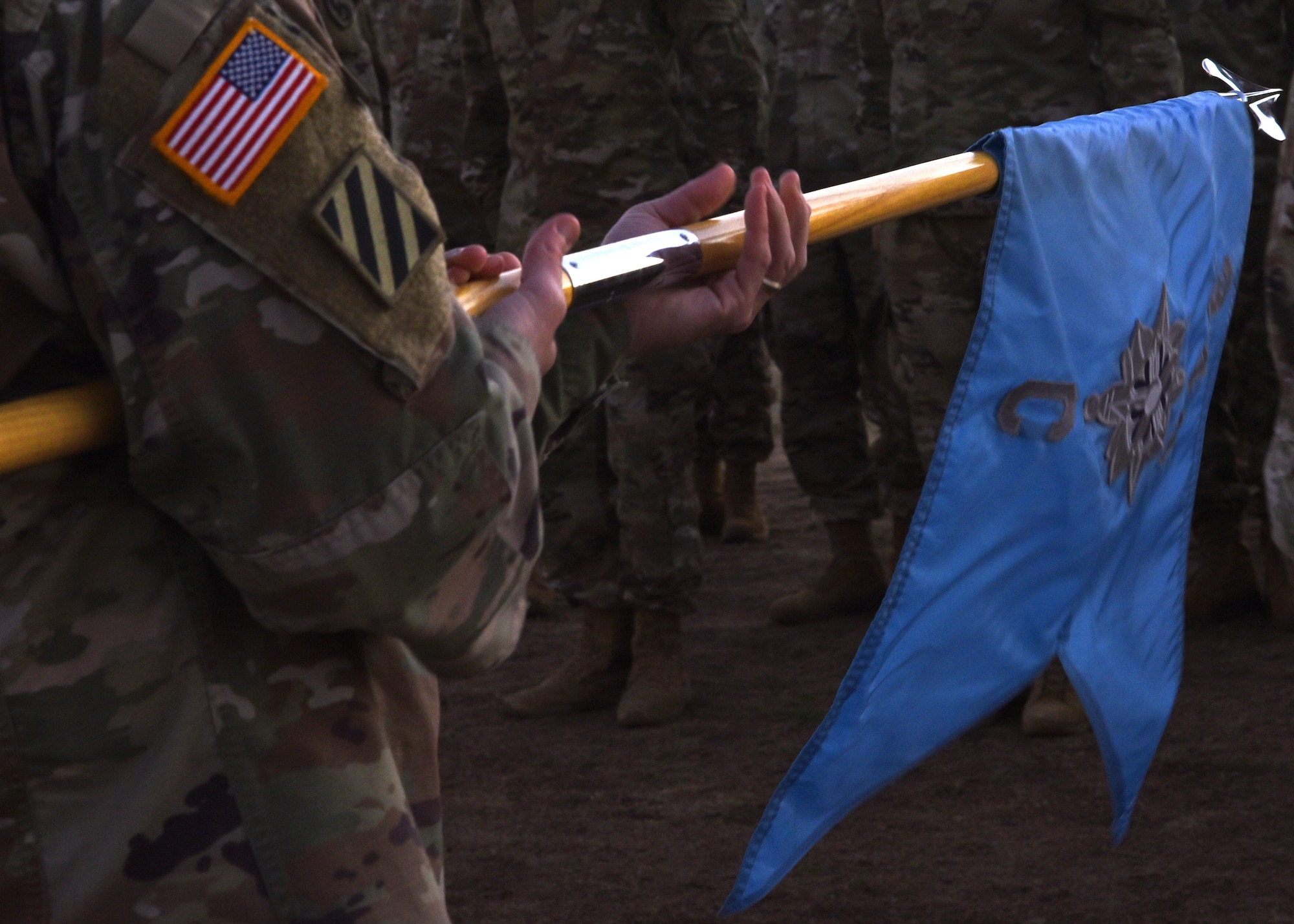 U.S. Army Lt. Col. Brian Ryan, 344th Military Intelligence Battalion commander, unrolls the Charlie Company Guidon at the Activation Ceremony and Assumption of Command on the parade field at Goodfellow Air Force Base, Texas, Jan. 24, 2019. Ryan prepared to pass the Guidon, which signifies him transferring his trust and the responsibility of the company’s enlisted members. (U.S. Air Force photo by Airman 1st Class Abbey Rieves)