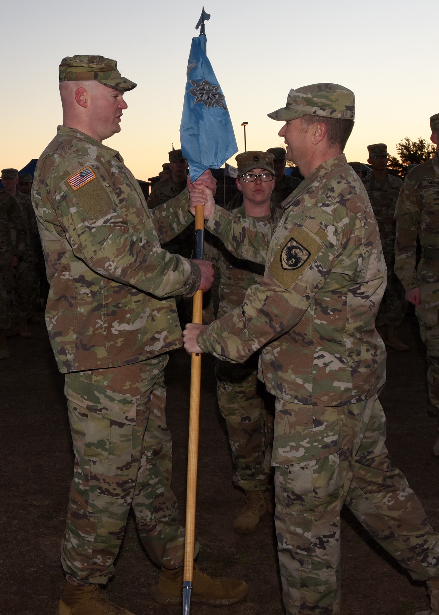 U.S. Army Capt. Nicholas Sauls, 344th Military Intelligence Battalion Charlie Company incoming commander, formally receives command from Army Lt. Col. Brian Ryan, 344th MI BN commander, at the Activation Ceremony and Assumption of Command on the parade field at Goodfellow Air Force Base, Texas, Jan. 24, 2019. The Guidon presentation signifies Ryan’s blessing for Sauls’ to take charge of his new unit.  (U.S. Air Force photo by Airman 1st Class Abbey Rieves)