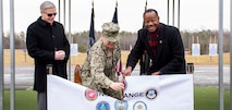 harles S. Phalen, Jr., Acting Director, Defense Counterintelligence and Security Agency (left), Cmdr. Angelique McBee, Marine Corps Base, Public Works Officer (center) and Mark Russ, Naval Criminal Investigative Service (NCIS) Deputy Director of Operational Support cut a ribbon during a ceremony for the grand opening of the new NCIS firing range.