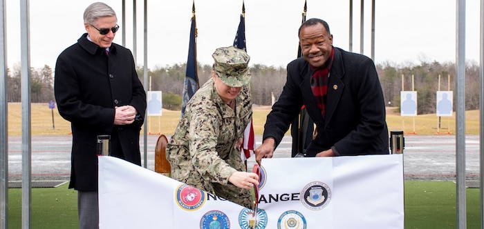 harles S. Phalen, Jr., Acting Director, Defense Counterintelligence and Security Agency (left), Cmdr. Angelique McBee, Marine Corps Base, Public Works Officer (center) and Mark Russ, Naval Criminal Investigative Service (NCIS) Deputy Director of Operational Support cut a ribbon during a ceremony for the grand opening of the new NCIS firing range.