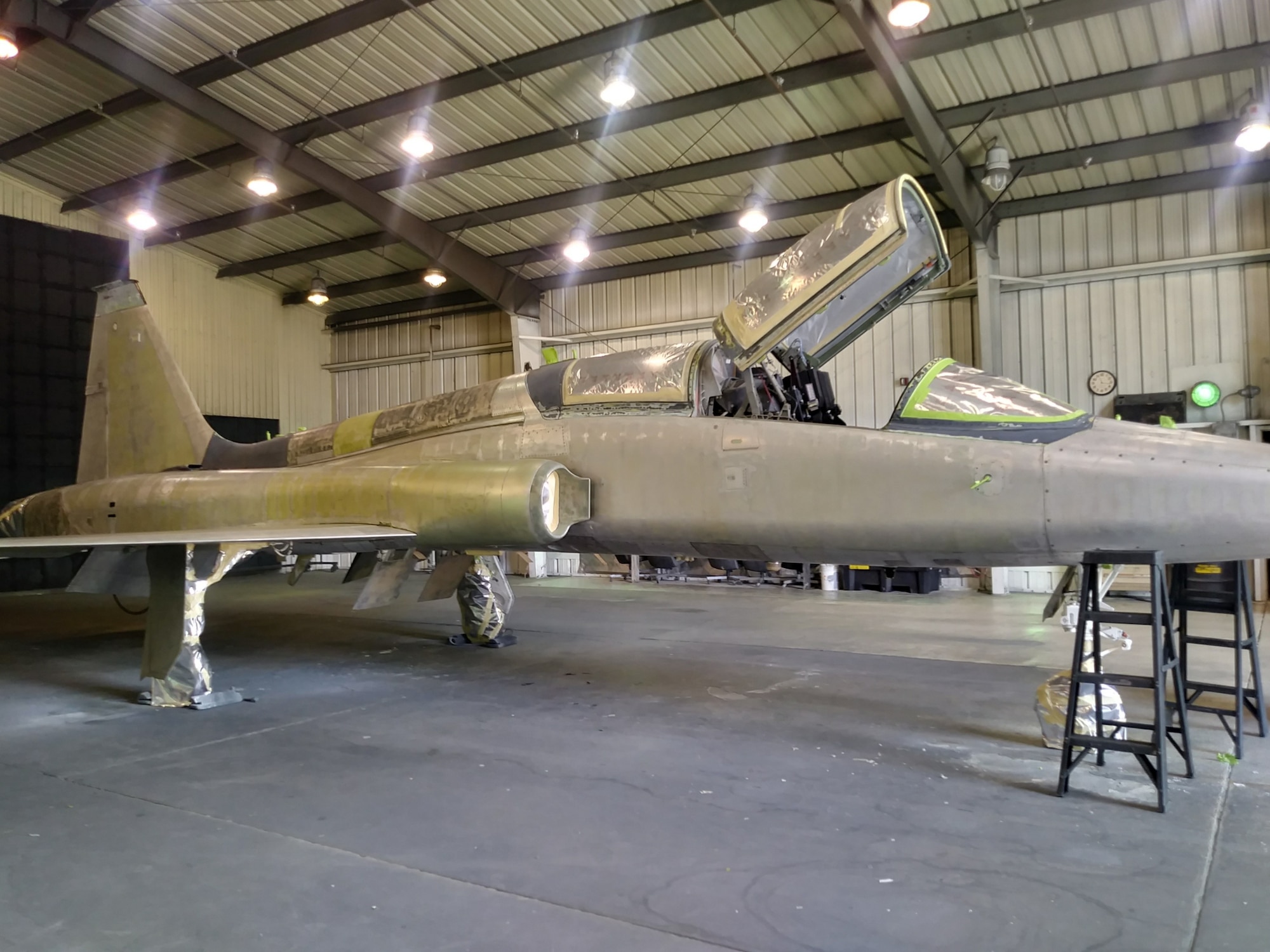 A T-38 Talon assigned to the 586th Flight Test Squadron sits in the paint barn after it’s been stripped. It awaits a new paint job honoring the 586th’s World War II namesake, the 586th Bombardment Squadron. (U.S. Air Force photo by Dwight Harp)